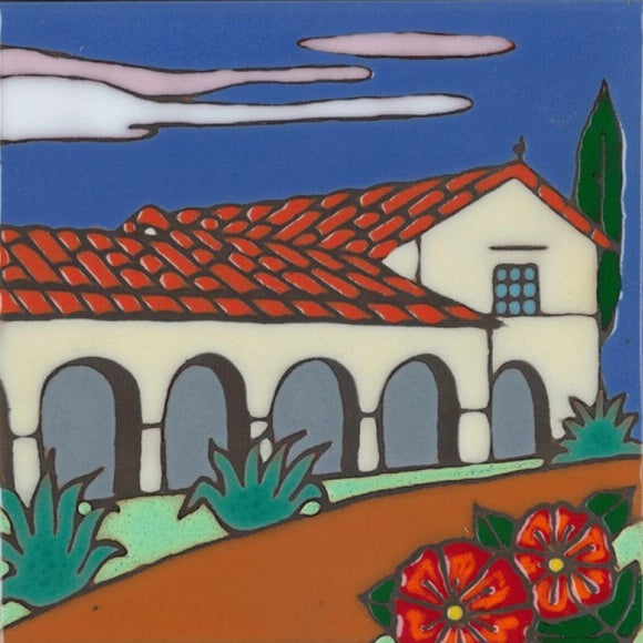 Ceramic tile with original art image of Mission San Juan Bautista hand painted & kiln fired creating vivid, jewel-like colors. American made, hand crafted tile has a hardboard backing making it suitable as a trivet, original wall art or without the backing, several can be combined to form a tile mosaic back splash.